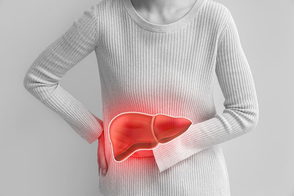 Young,Woman,Feeling,Discomfort,In,Liver,On,Light,Background,,Closeup